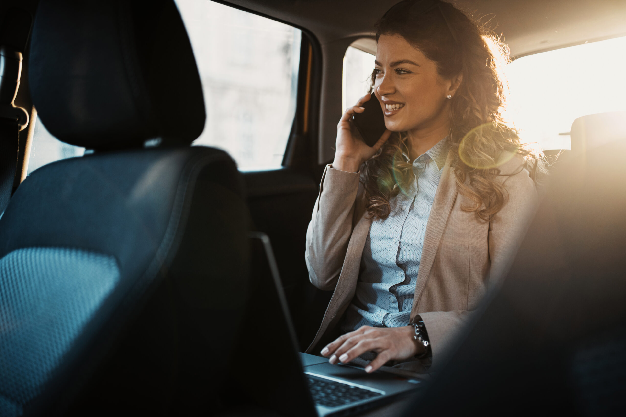 Woman riding in black car